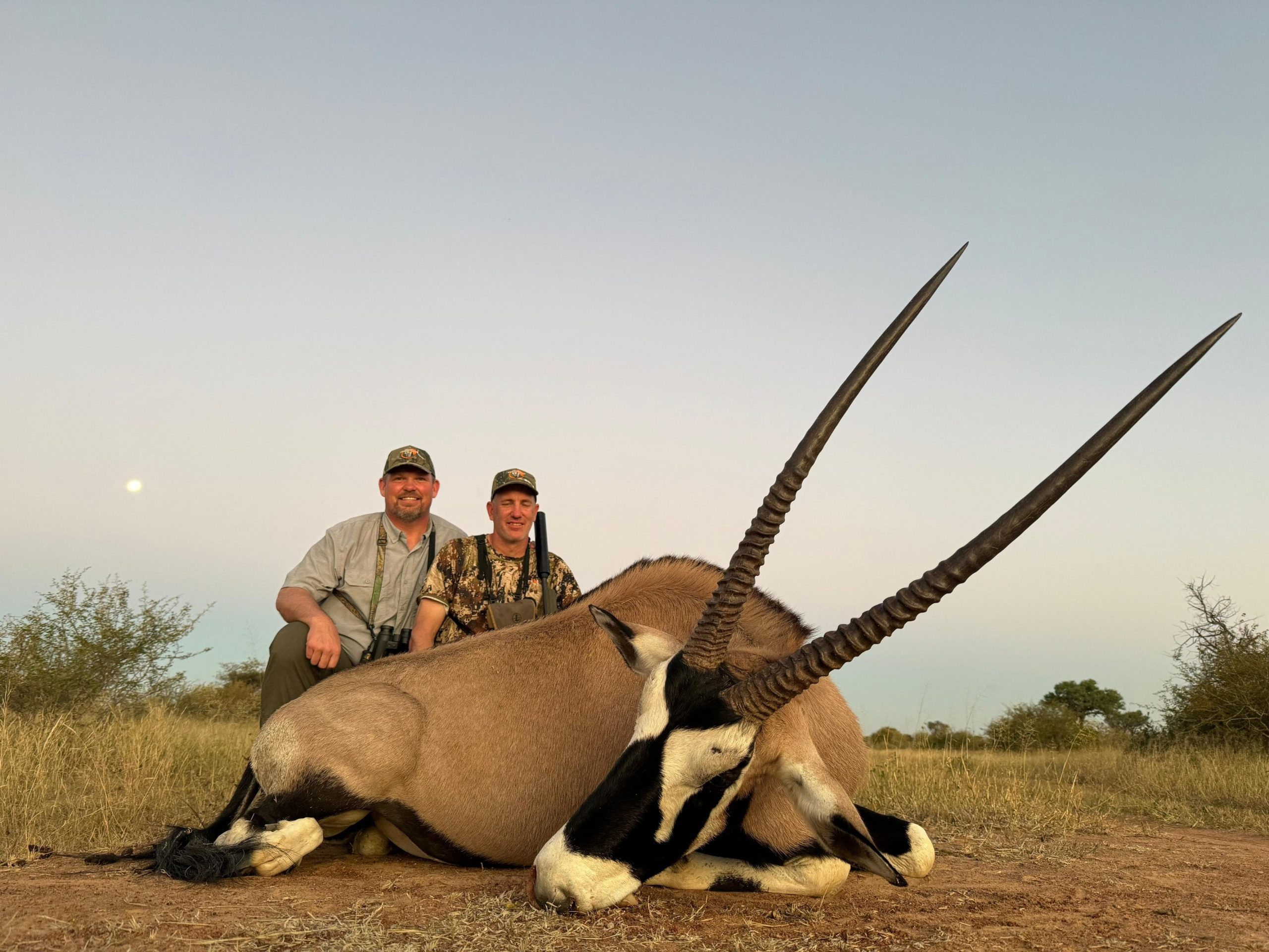 Safari guests enjoying a successful African hunting experience